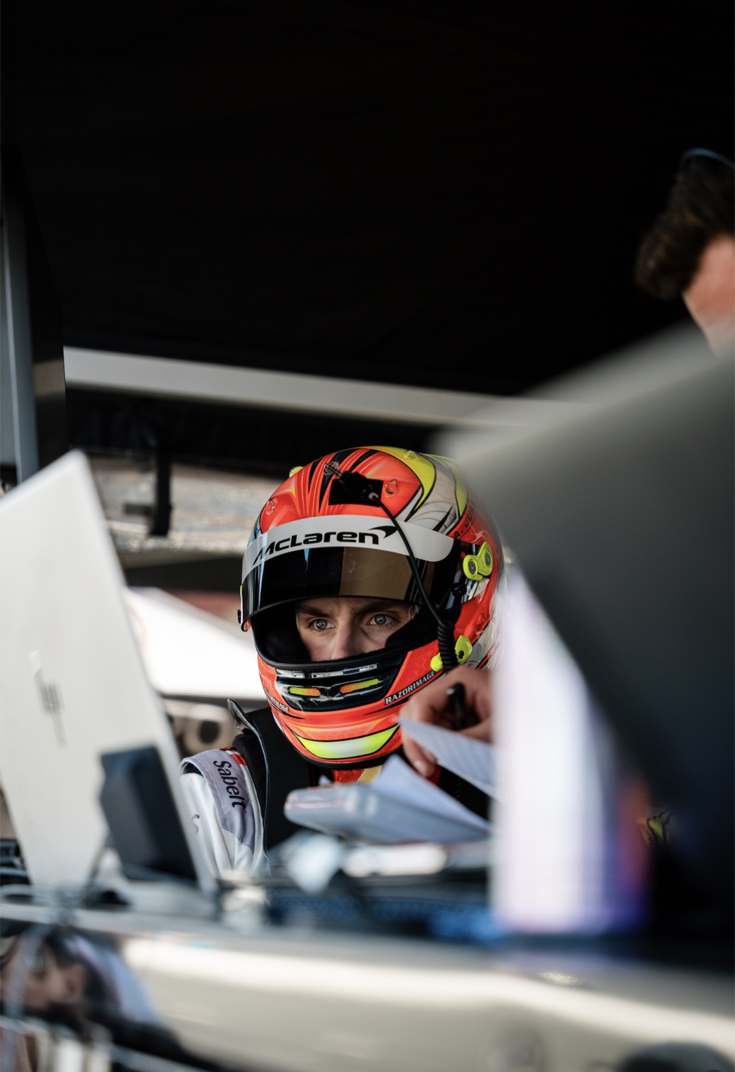 Austin focused at the timing stand in his McLaren helmet
